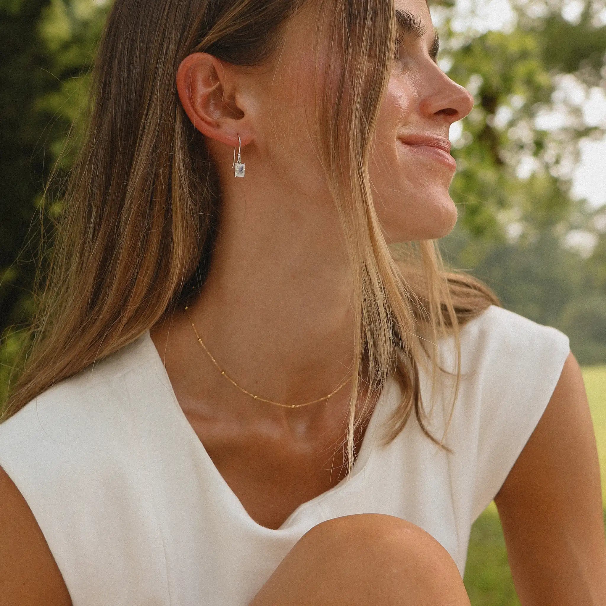 woman wearing dainty gold necklace by indie and harper Australia 