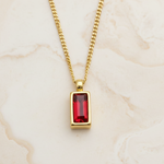 Dainty gold necklace with ruby red faceted stone 