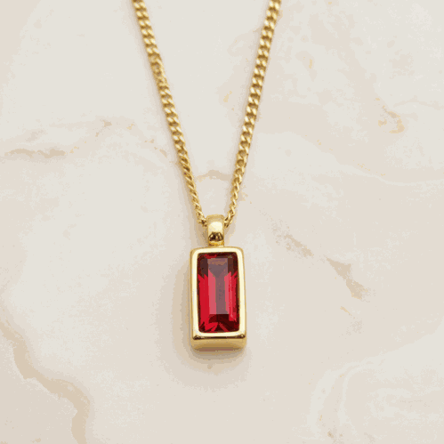 Dainty gold necklace with ruby red faceted stone 