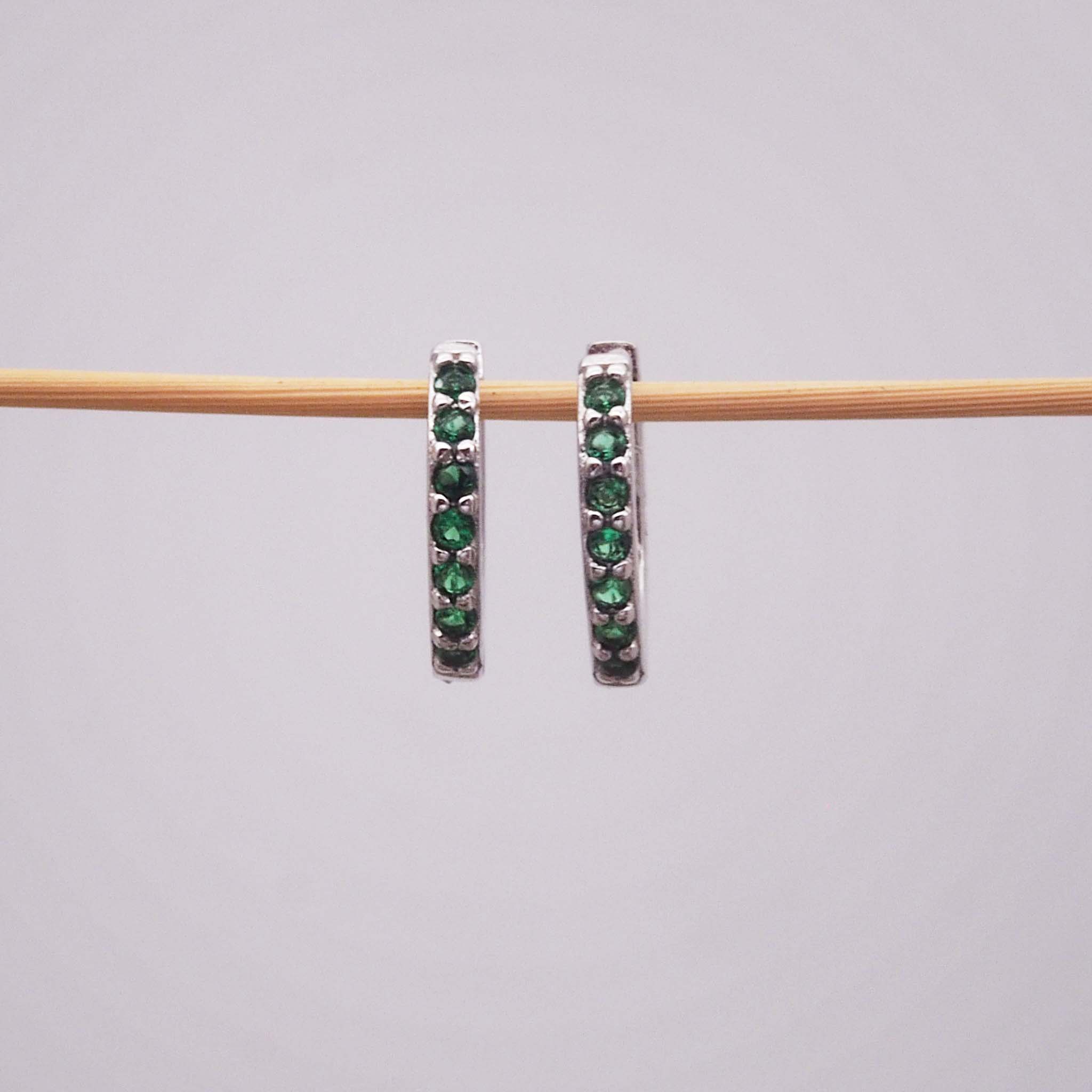 Dainty huggie earrings - sterling silver and green CZ by indie and harper australia