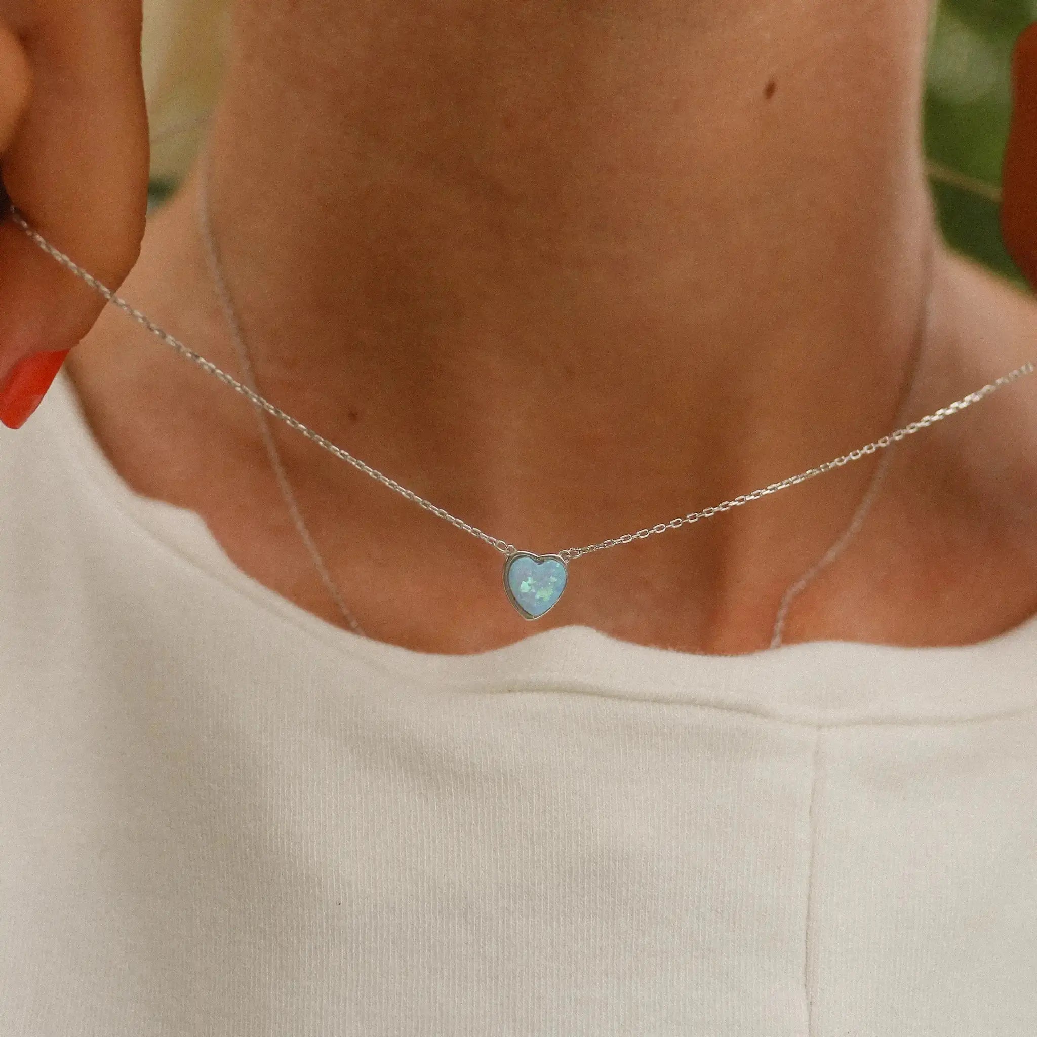 dainty heart blue opal necklace being worn - blue opal jewellery by Australian jewellery brands indie and harper