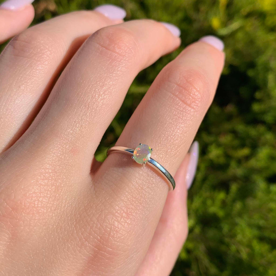 dainty opal ring - colourful dainty natural opal gemstones in a sterling silver claw set ring - women's dainty opal jewellery online by indie and harper