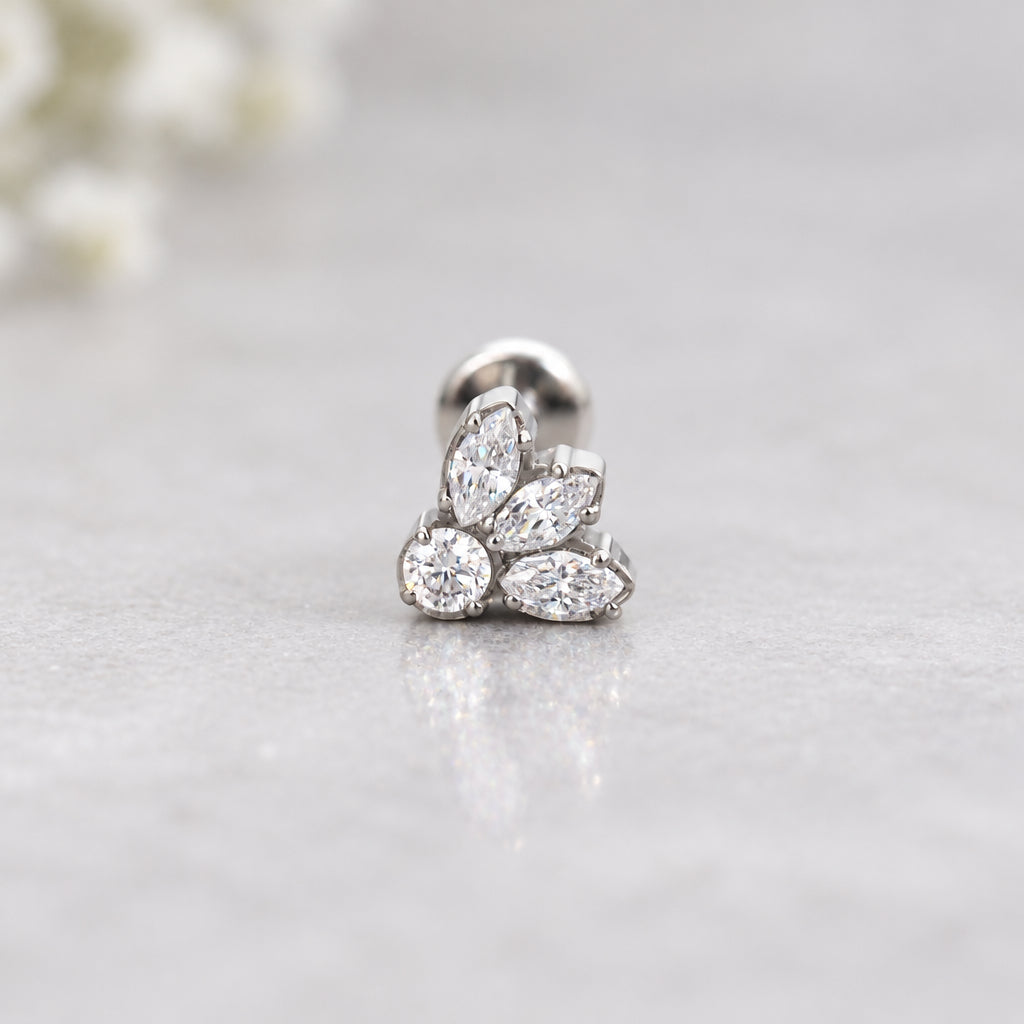 Silver petal flat back earring with cubic zirconia on a grey surface