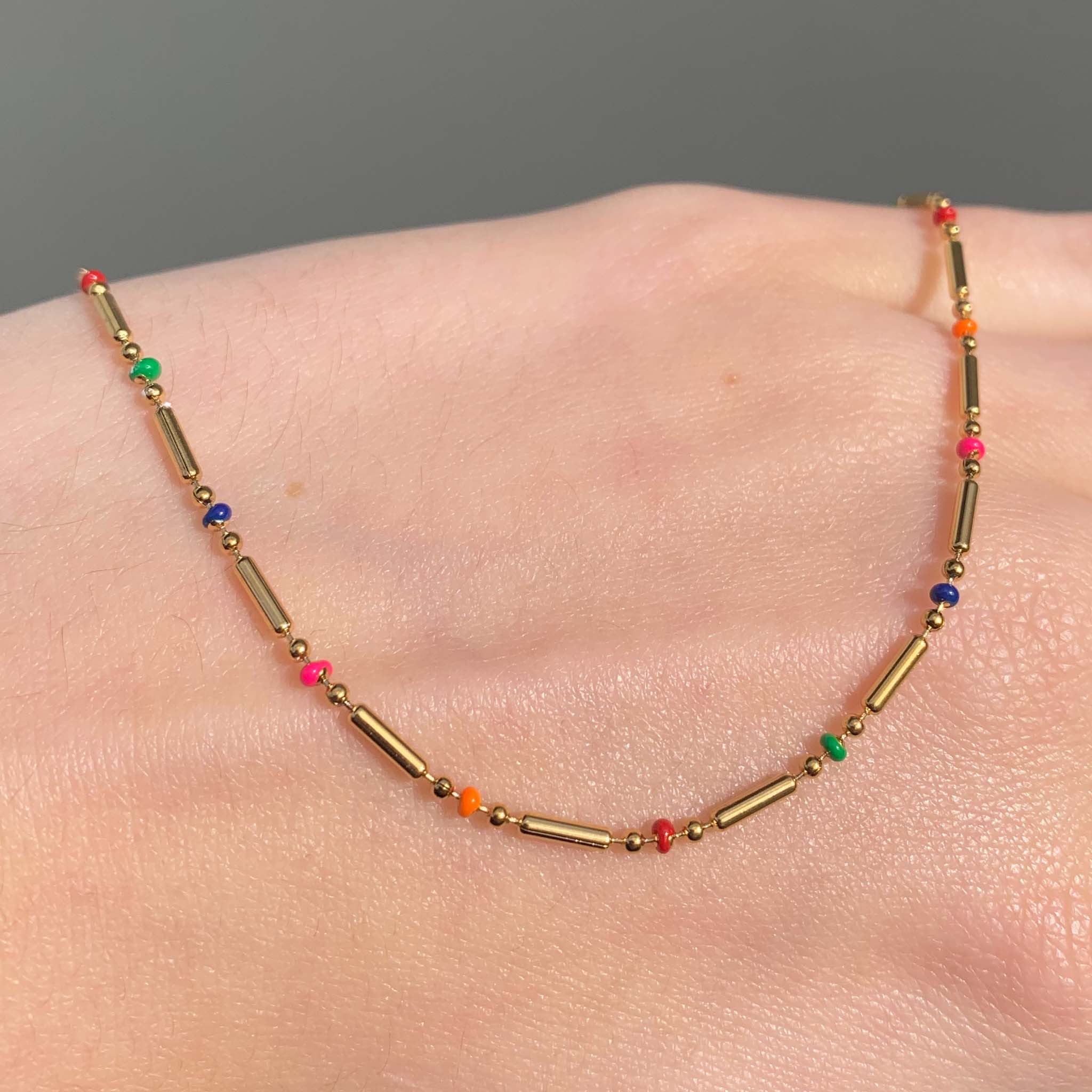 Dainty rainbow and gold beaded necklace by Australian jewellery brands indie and harper