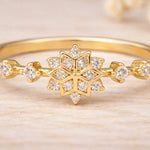 Gold snowflake ring showing the clear cubic zirconia snowflake cluster, close-up