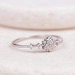 Sterling Silver ring with cubic zirconias in a snowflake celestial design