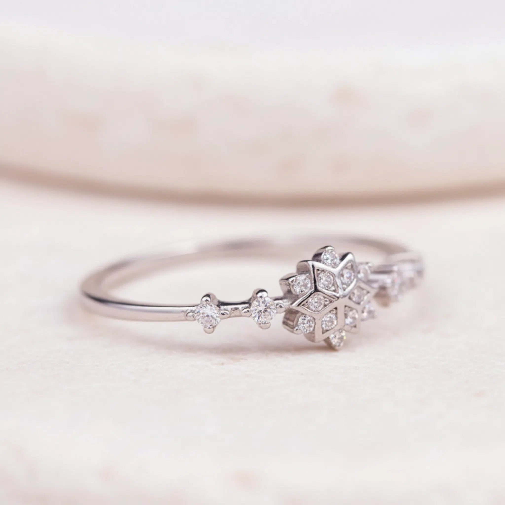 Sterling Silver ring with cubic zirconias in a snowflake celestial design