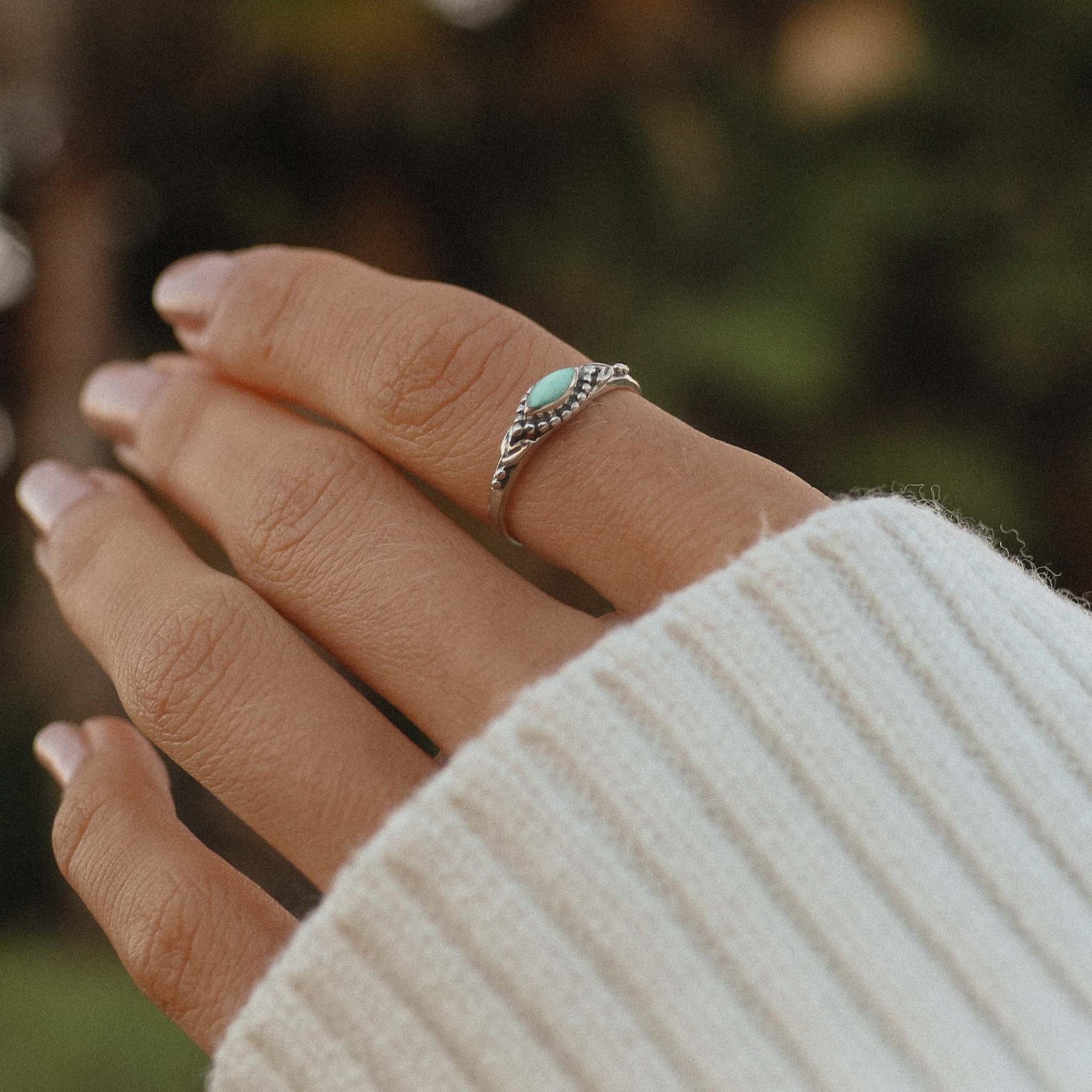 Minimalist turquoise gemstone ring in sterling silver styled for everyday wear