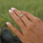Woman wearing sterling silver dainty minimalist turquoise ring 