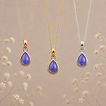 December Tanzanite Necklace set by Indie and Harper; 3 pieces in rose gold, yellow gold, and silver with purple teardrop pendants.