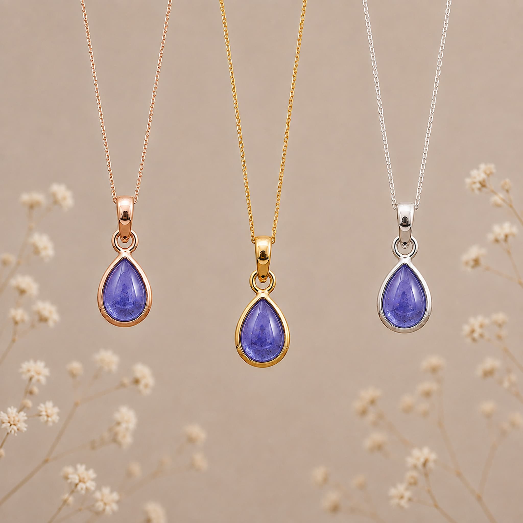 December Tanzanite Necklace set by Indie and Harper; 3 pieces in rose gold, yellow gold, and silver with purple teardrop pendants.