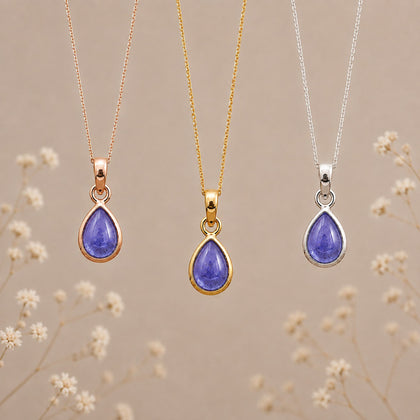 December Tanzanite Necklace set by Indie and Harper; 3 pieces in rose gold, yellow gold, and silver with purple teardrop pendants.