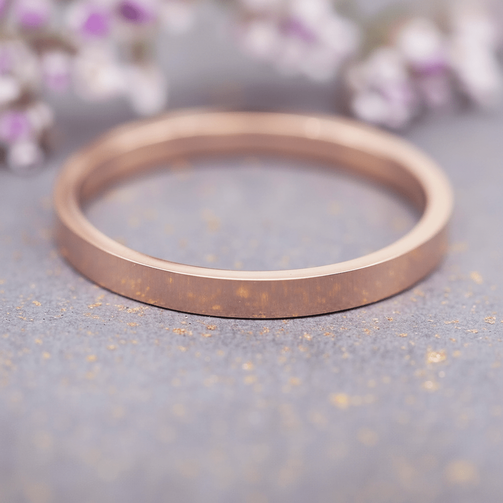 rose gold band stacker ring on a grey surface, as one of the three rings in the rose gold multi ring set
