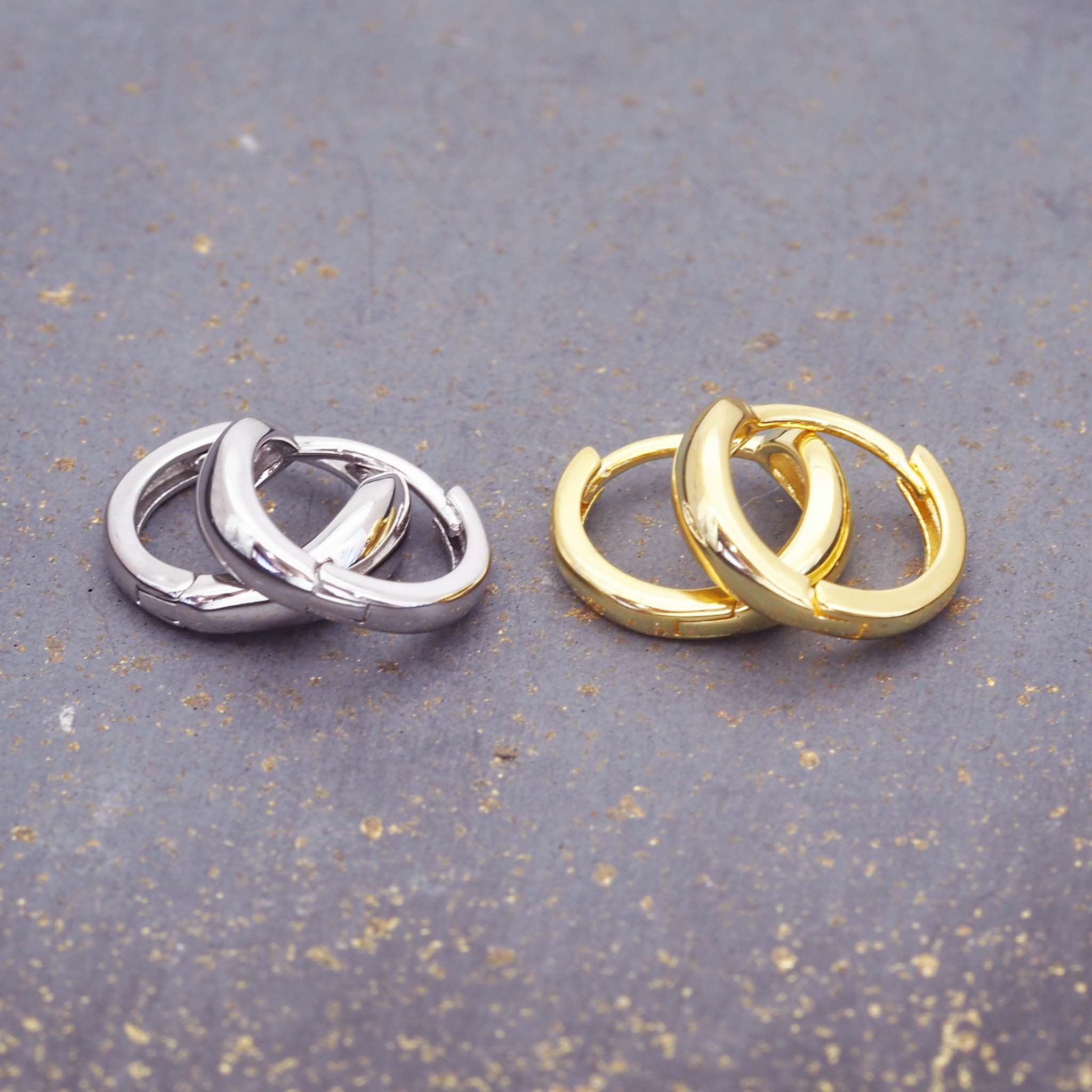 dainty huggie style hoop earrings in silver and gold by indie and harper australia