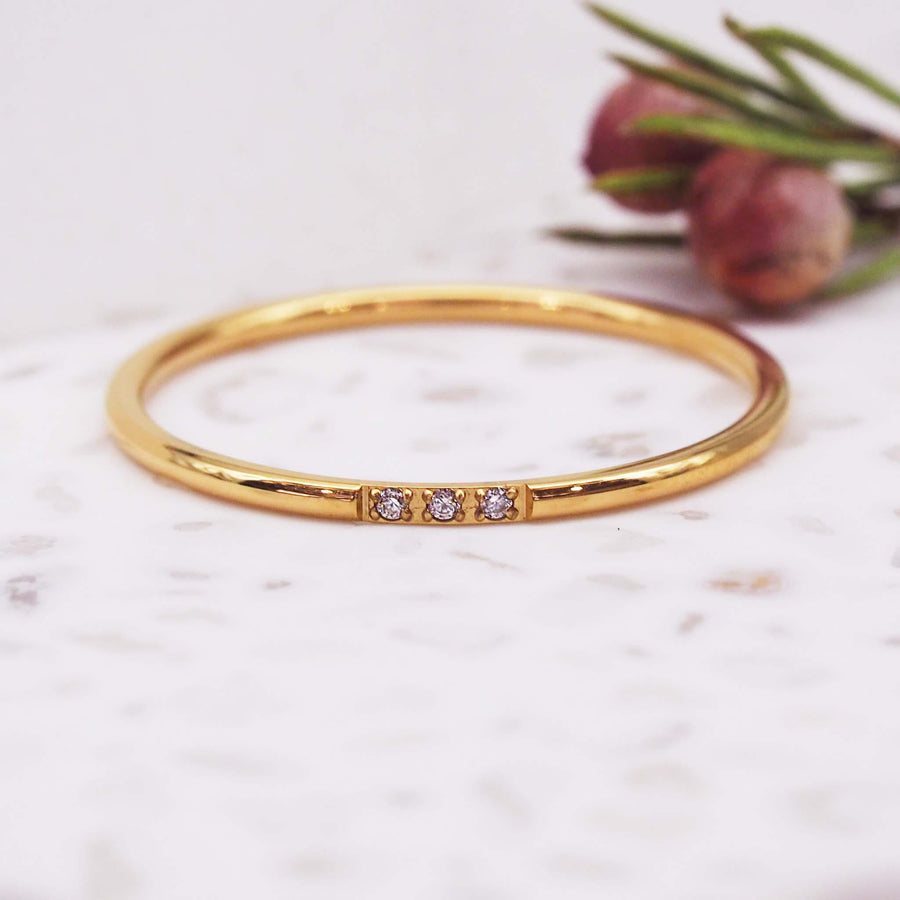 gold stacker ring with 3 cubic zirocnias- womens gold jewellery by indie and harper
