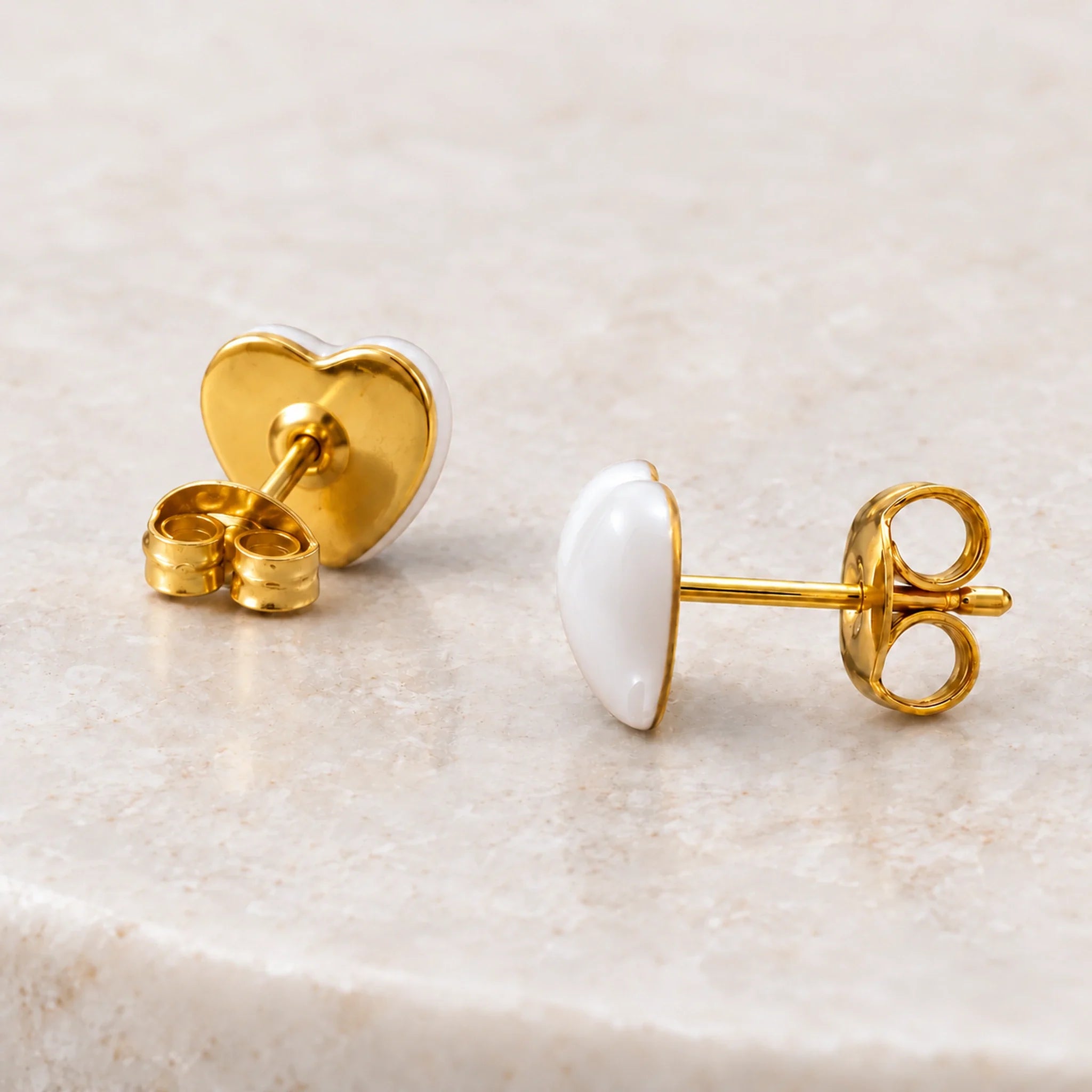 White epoxy heart stud earrings in gold PVD stainless steel, back view