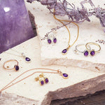 group shot of february birthstone jewellery including amethyst earrings, rings and necklaces by indie and harper jewellery australia