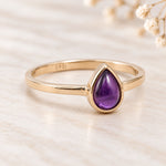Side view of soft 9k gold February natural amethyst birthstone ring