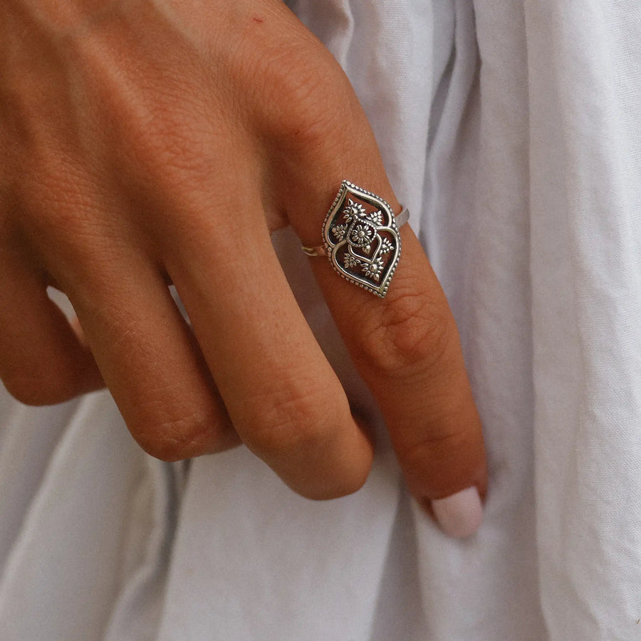 woman wearing sterling silver mandala shaped ring