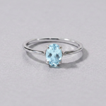 Front-view ring with matched pale blue topaz