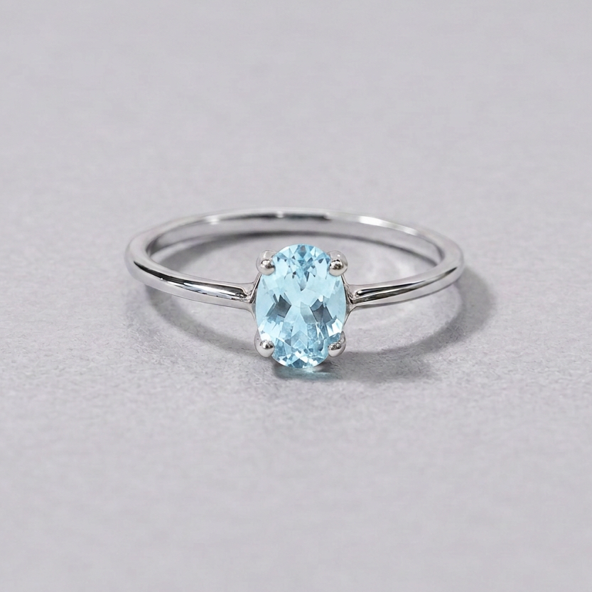 Front-view ring with matched pale blue topaz