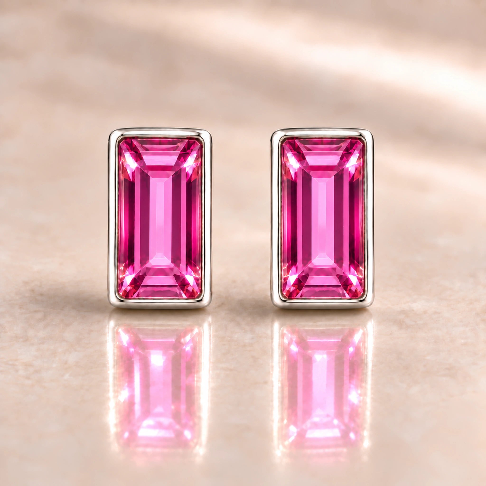 Fuchsia Austrian crystal baguette stud earrings in polished sterling silver, front view