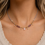 close up of a woman wearing a gold natural gemstone beaded Necklace 