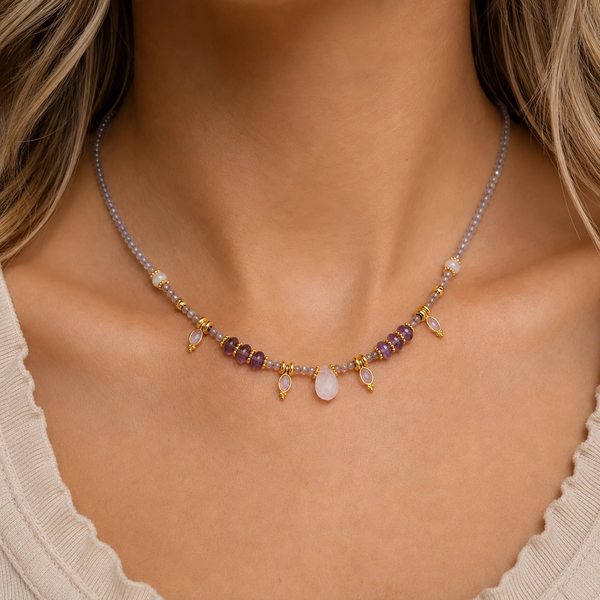 close up of a woman wearing a gold natural gemstone beaded Necklace 