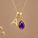 Gold initial A necklace with a natural February amethyst