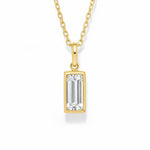 gold april birthstone necklace with clear cubic zirconia on a white background.