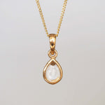 Gold april birthstone necklace with a pear-shaped natural clear quartz gemstone pendant - birthstone jewellery gift for her