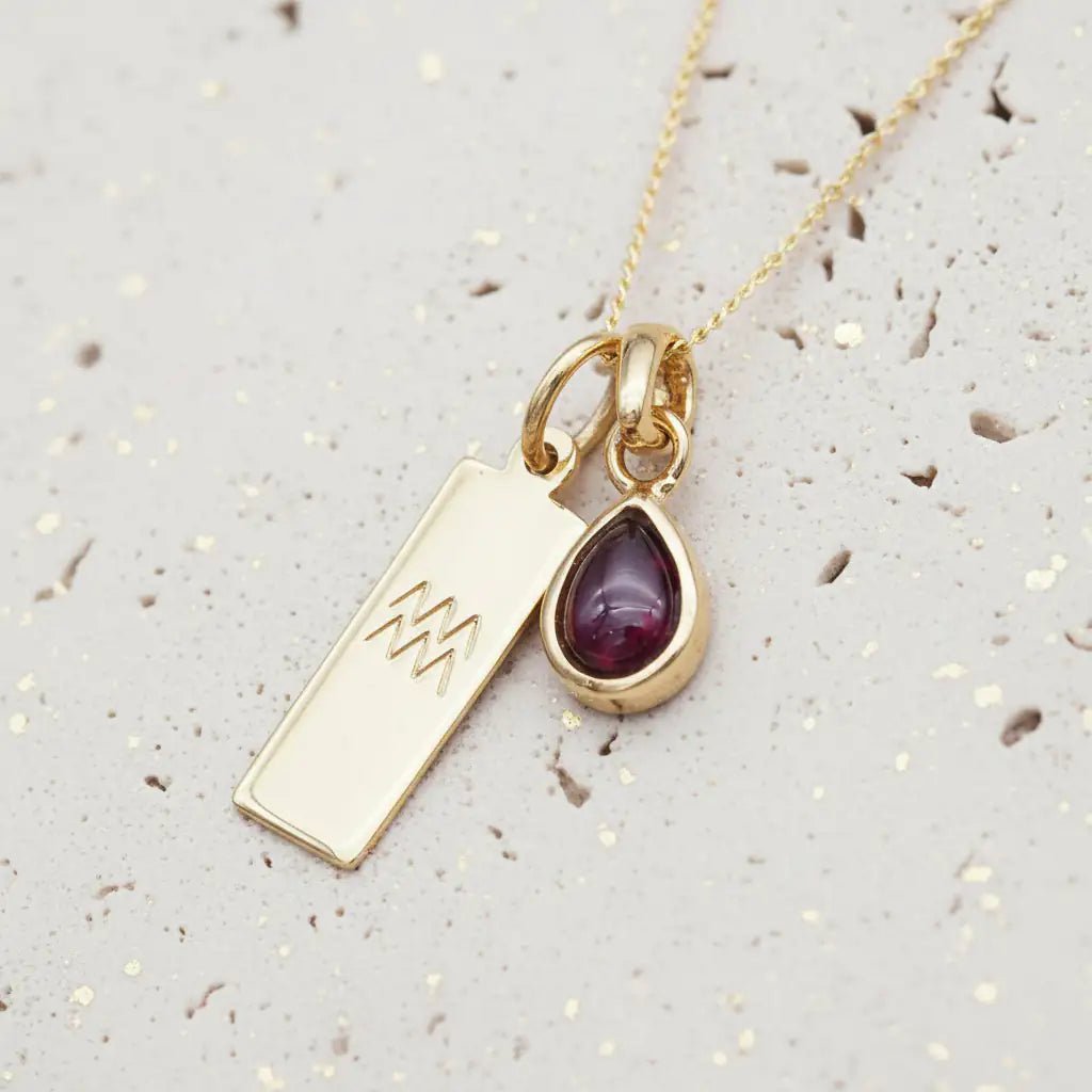 Gold January Birthstone Necklace with a pear-shaped natural Garnet gemstone pendant and Aquarius Zodiac pendant