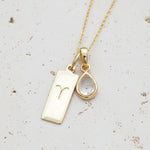 Gold April Birthstone necklace with a pear-shaped natural Herkimer Quartz pendant and a Aries zodiac pendant