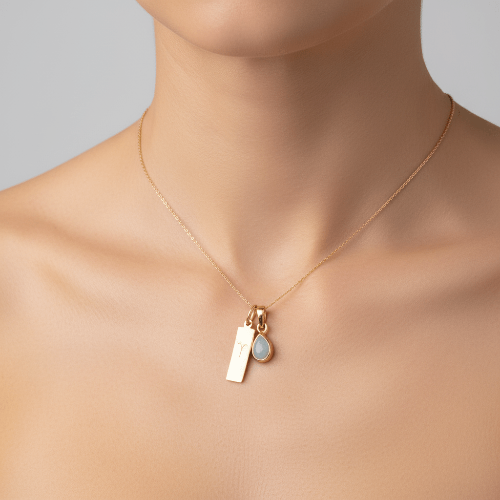gold aries zodiac and march birthstone aquamarine necklace being worn