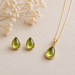 Gold August Birthstone Peridot Jewellery Set featuring natural peridot earrings and matching peridot necklace.