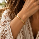 Woman wearing a 5mm waterproof gold bangle bracelet