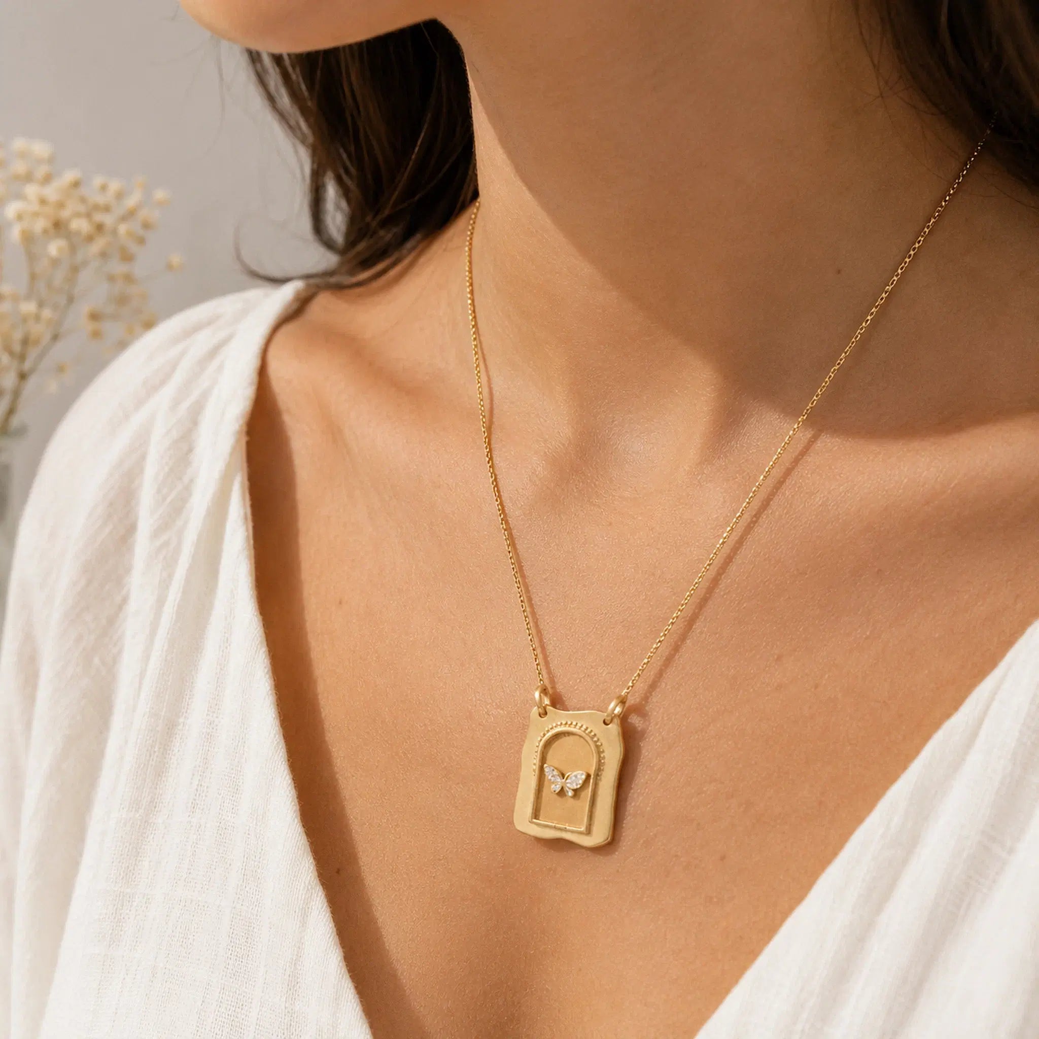 gold cz butterfly gate necklace worn