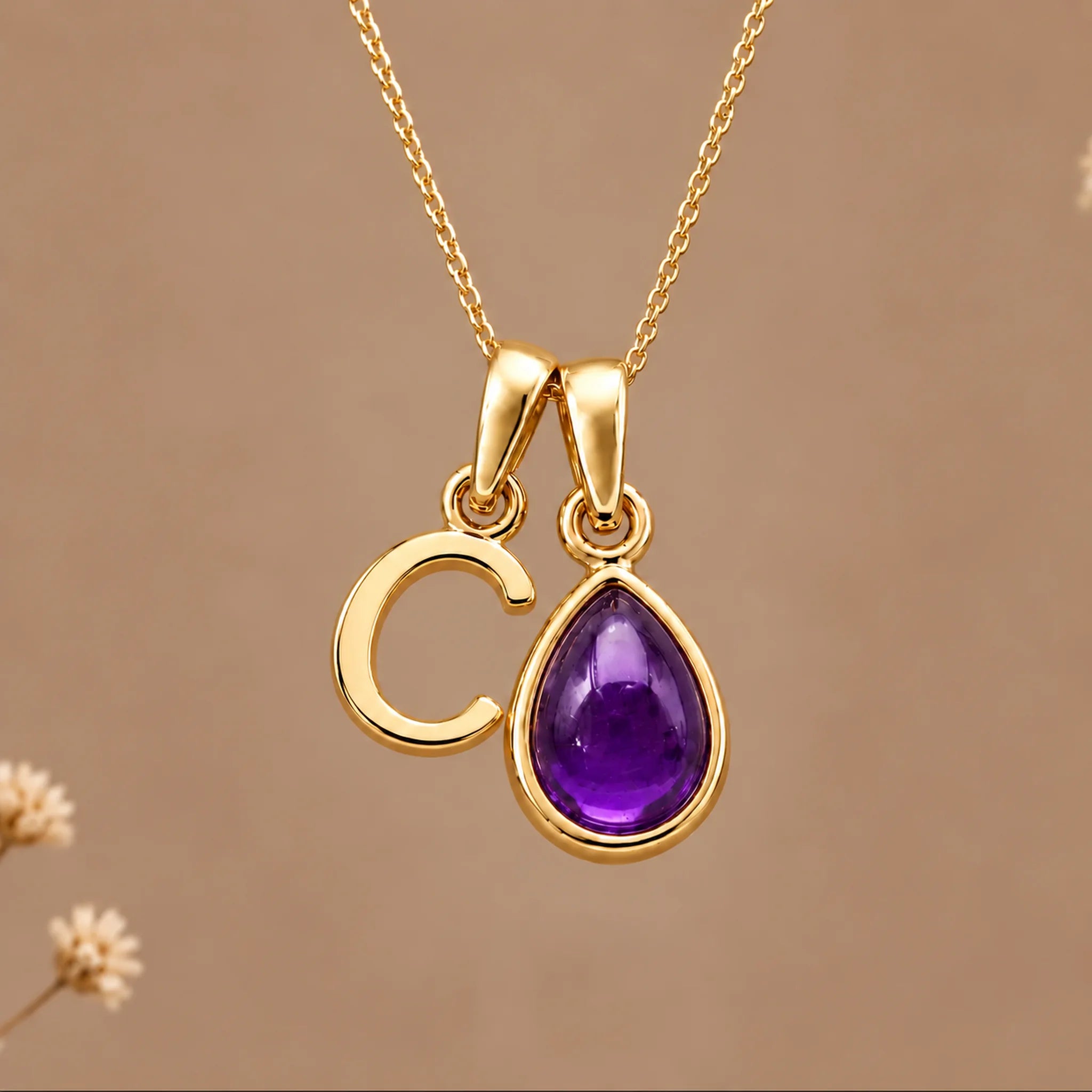 Gold initial C necklace with a natural February amethyst