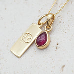 Gold July Birthstone necklace with a pear-shaped natural Ruby pendant and a Cancer zodiac pendant