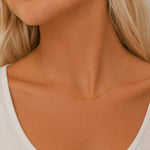 minimalist 16 inch Gold chain necklace on a person with a neutral background