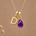 Gold initial D necklace with a natural February amethyst