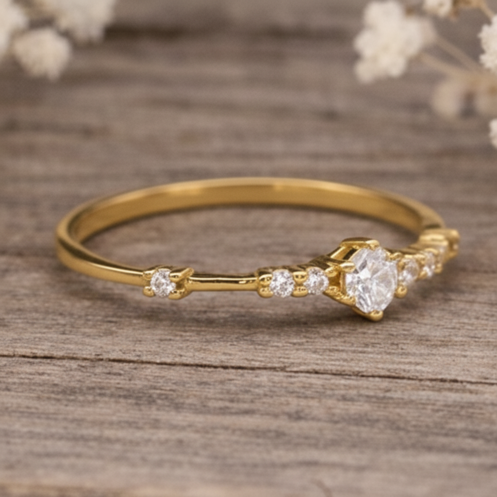 Gold ring with czs on a wooden surface