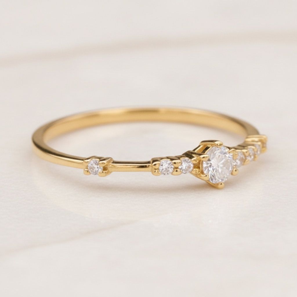 Gold ring with czs on a wooden surface