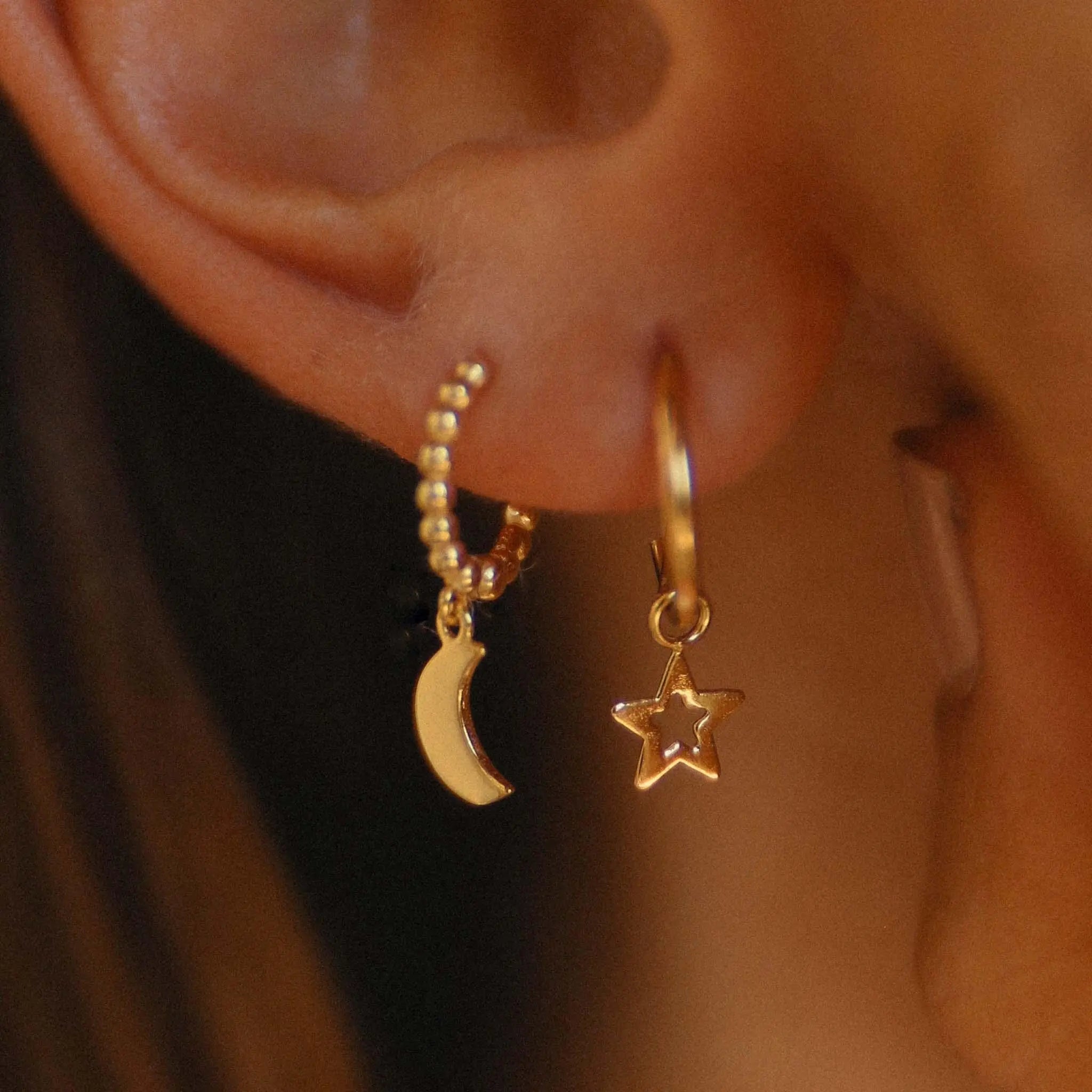 Woman wearing Gold earrings by Australian jewellery brands online indie and Harper