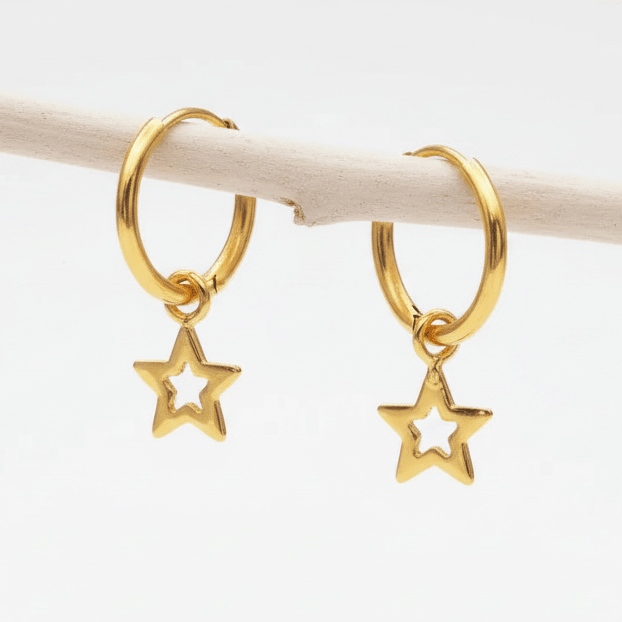 Gold hoop earrings with star charms on a white background