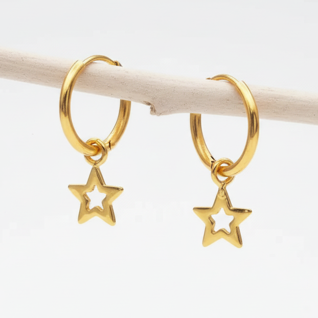 Gold hoop earrings with star charms on a white background