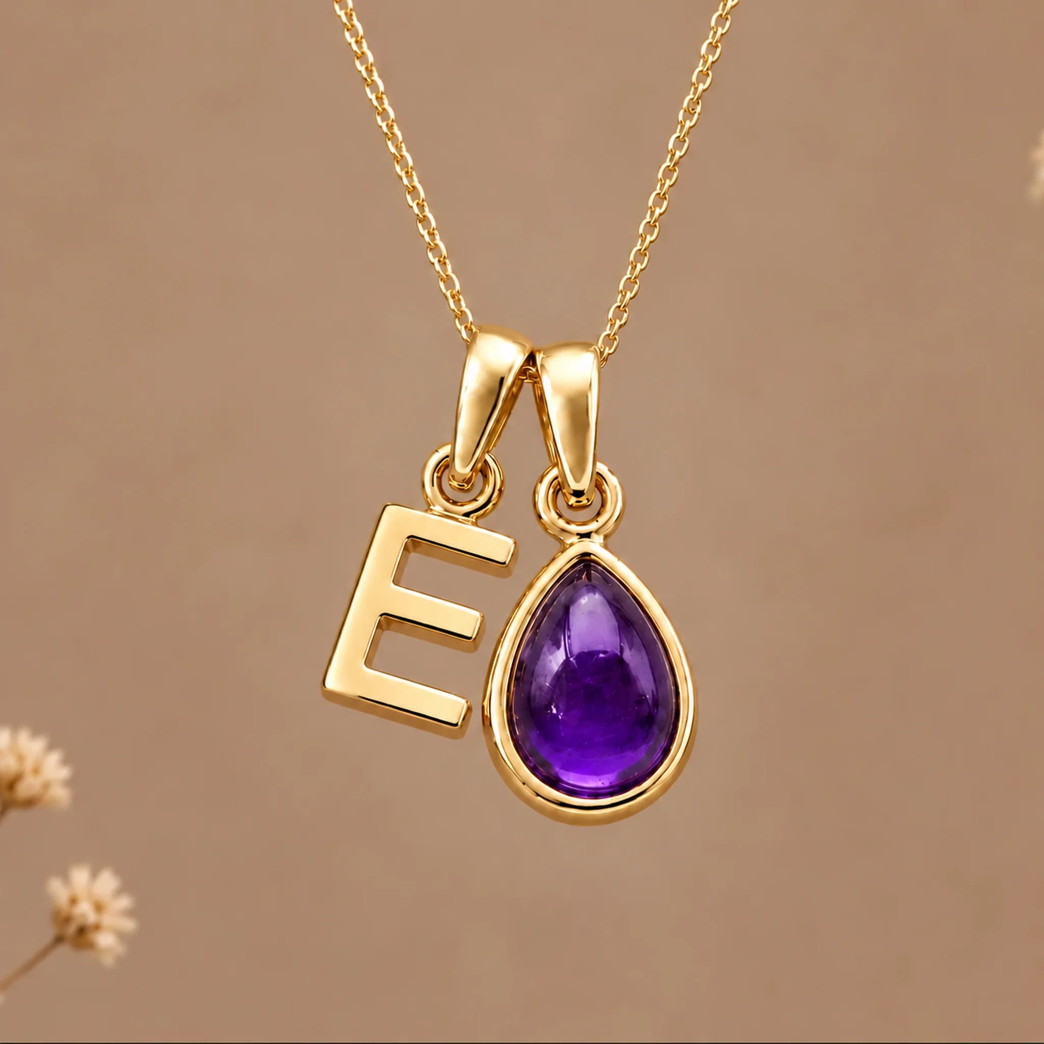 Gold initial E necklace with a natural February amethyst
