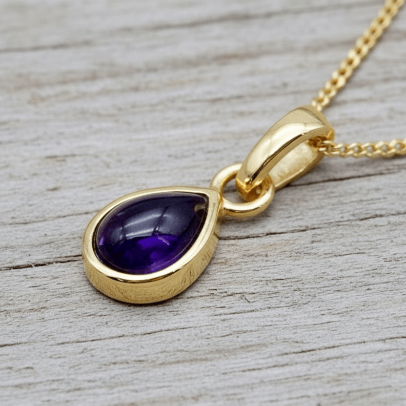 Gold Necklace with tear drop bezel set amethyst.