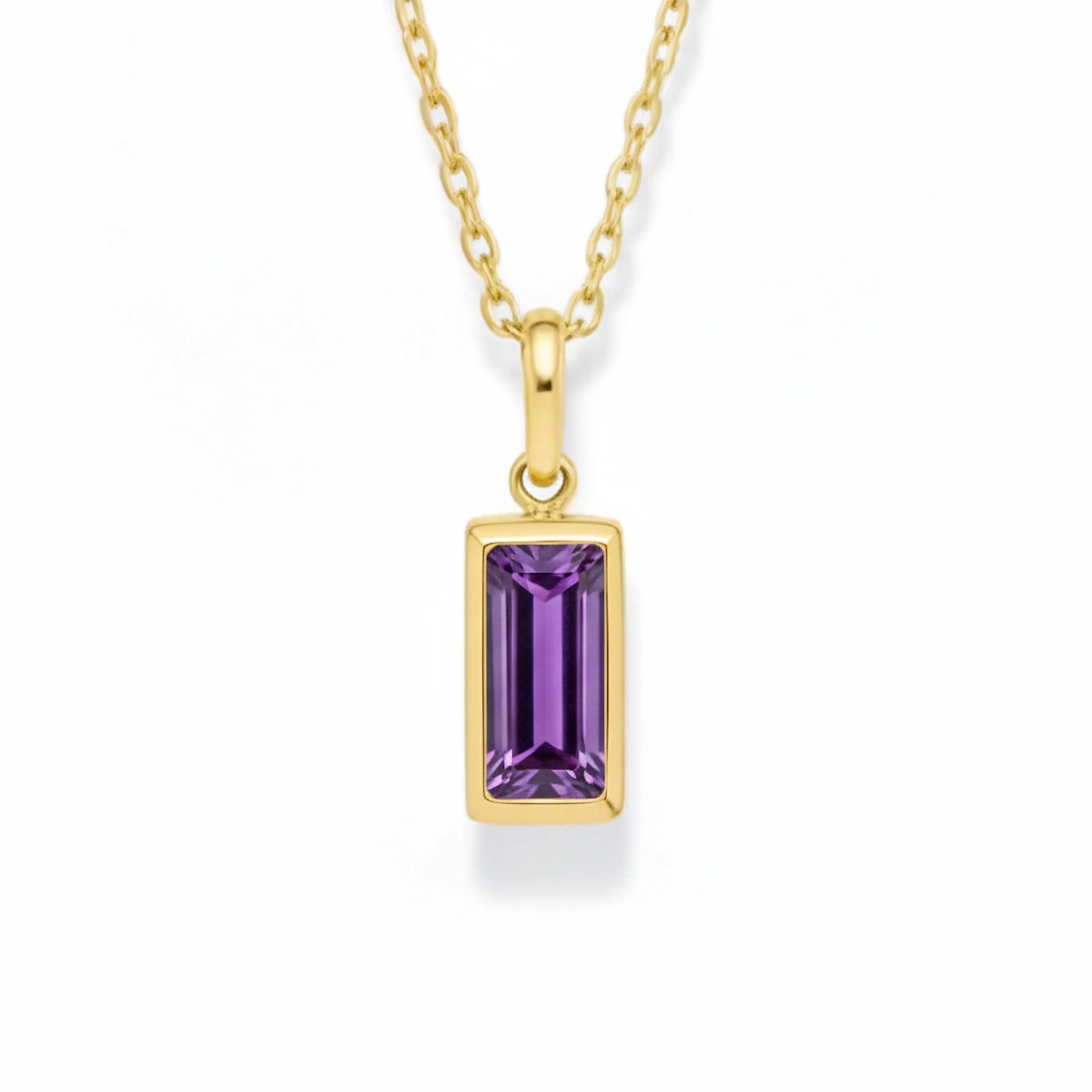 gold february birthstone necklace with purple cubic zirconia on a white background.