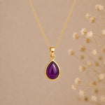 Gold February Birthstone necklace with a pear-shaped natural amethyst gemstone pendant - birthday jewellery gift